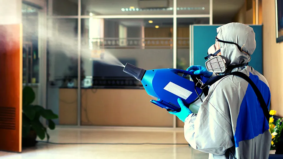 Technician fogging an office lobby